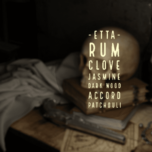 Etta. Rum, clove, jasmine, dark wood accord, patchouli. The image shows a human skull stacked on books and charts with a flintlock pistol in the foreground.