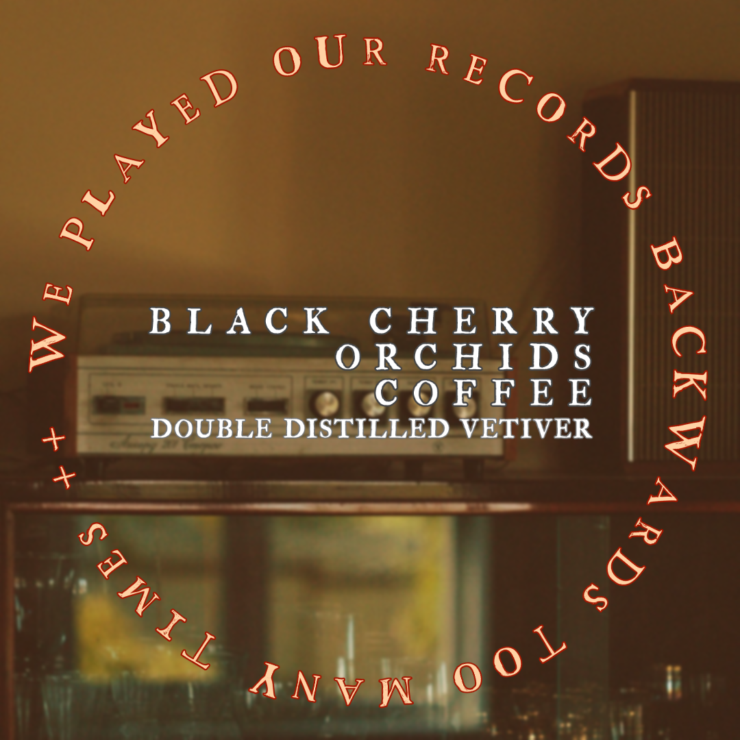 We Played Our Records Backwards Too Many Times. Black cherry, orchids, coffee, vetiver. Image depicts a vintage record player.