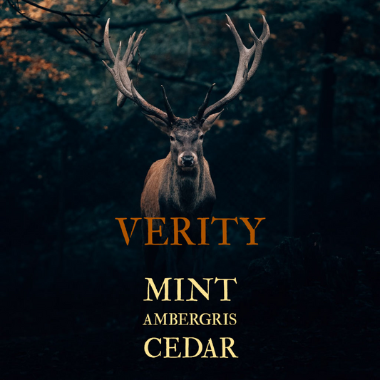 Verity. Mint, ambergris, cedar. Image depicts a large buck facing the camera.